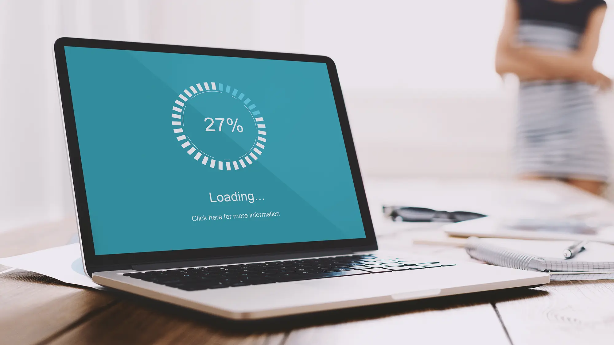 Laptop showing a web load speed meter indicating fast page performance
