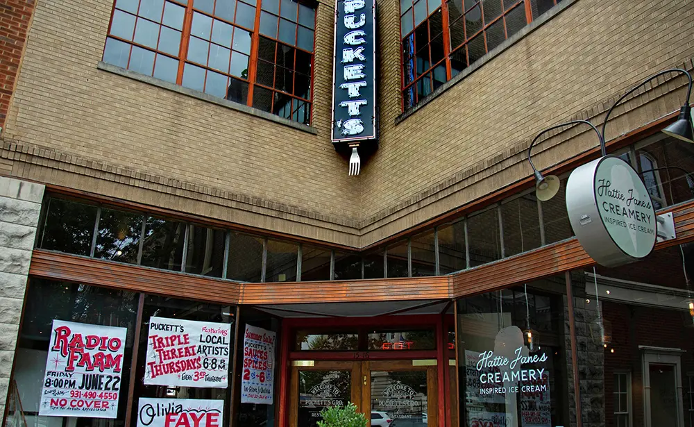 Exterior of a locally owned Maury County business in downtown Columbia TN, clear signage and customers arriving, feature image for the Local Search 2026 Guide